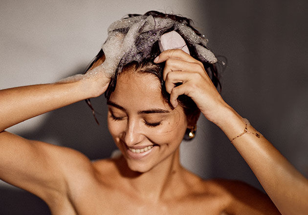 Lathering Solid Shampoo Bar into Hair