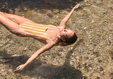 Image showing a woman floating on the beach