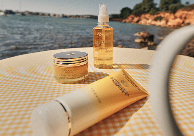 This image shows the L'OCCITANE Immortelle range including the L'OCCITANE Immortelle Divine Cleansing Cream, L'OCCITANE Divine Cleansing Balm, L'OCCITANE Immortelle Precious Cleansing Oil