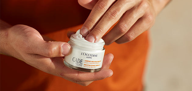 A man about to apply the L'OCCITANE Cade Revitalising Cream