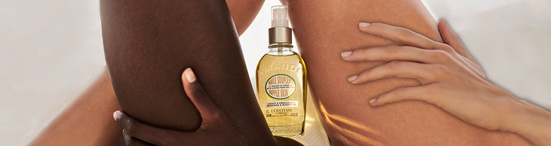 Image showing L'OCCITANE Almond shower Oil positioned in the middle of the legs of two women