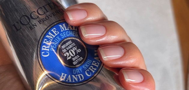 Woman applying L'OCCITANE shea Nail and Cuticle Nourishing Oil