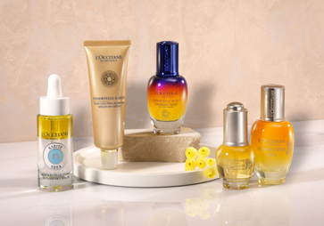 This image shows the L'OCCITANE Immortelle Divine Eye Balm, the L'OCCITANE Immortelle Overnight Reset Serum and the L'OCCITANE Immortelle Divine Serum