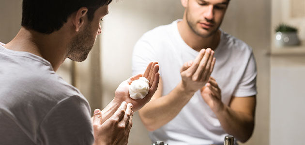 A man using the L'OCCITANE Cade Refreshing Shaving Gel