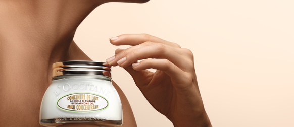 Woman holding L'OCCITANE Shea Ultra Rich Body Cream, Organic Shea Butter, Fair Trade, Burkina Faso, Natural Remedy, Comforting & Nourishing