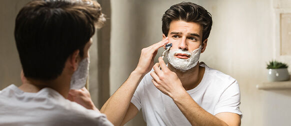 Man shaving with L'OCCITANE Cade Shaving Cream