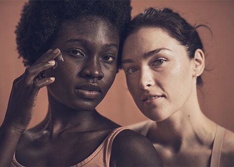 Image shows two women facing the audience