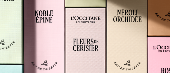 Woman spritzing L'OCCITANE Rose Eau de Toilette 
