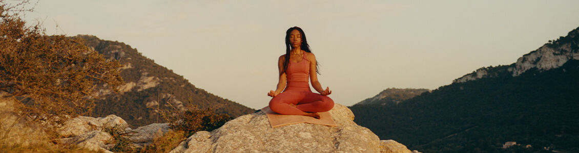 Woman in meditation while practising yoga. 