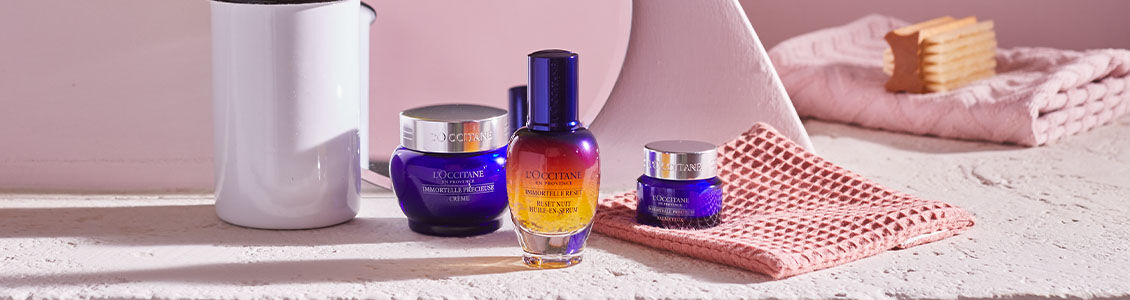 The image shows the L'OCCITANE ImmortelleReset Serum, L'OCCITANE Immortelle Precious cream and L'OCCITANE Immortelle Precious Eye Balm