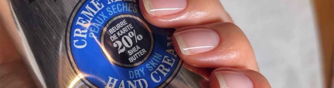 Woman applying L'OCCITANE shea Nail and Cuticle Nourishing Oil