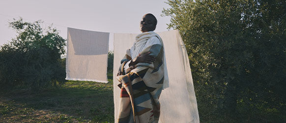 This image shows a woman outside doing the house chores