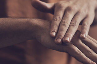 Man applying L&rsquo;OCCITANE Shea Intensive Hand Balm