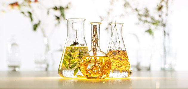 The image shows 3 scientific containers filled with herbs and essential oils