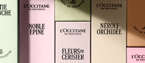 Woman spritzing L'OCCITANE Rose Eau de Toilette 