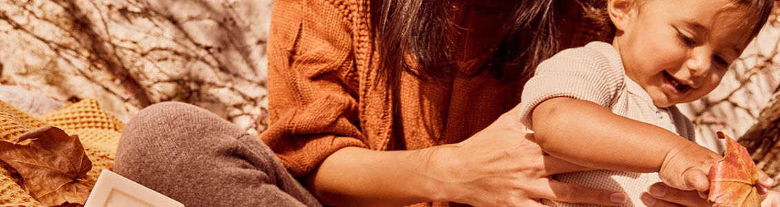 This image shows a woman holding a baby