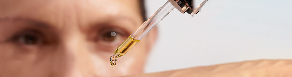 Image showing a scientific expert holding a dropper