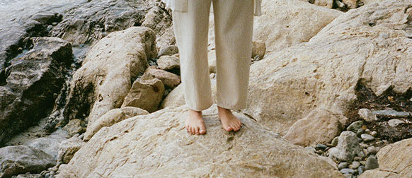 Person standing on rocks  