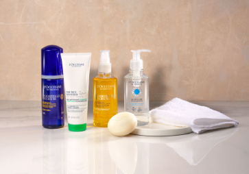 This image shows L'OCCITANE cleansers including the L'OCCITANE Precious Essential Water, L'OCCITANE Immortelle Precious Cleansing Oil
