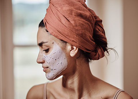 This image shows a woman doing her skincare routine and ending with a mask